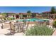 Inviting pool area with seating and landscaping at 42424 N Gavilan Peak Pkwy # 42206, Anthem, AZ 85086