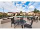 Relaxing pool area with patio tables and chairs at 42424 N Gavilan Peak Pkwy # 42206, Anthem, AZ 85086