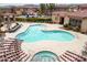 Community pool and spa with surrounding lounge area at 42424 N Gavilan Peak Pkwy # 42206, Anthem, AZ 85086