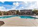 Community pool with lounge chairs and tables at 42424 N Gavilan Peak Pkwy # 42206, Anthem, AZ 85086