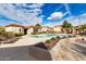 Community pool with lounge chairs and landscaping at 42424 N Gavilan Peak Pkwy # 42206, Anthem, AZ 85086