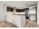 Modern kitchen with stainless steel appliances and marble countertops at 4739 N Scottsdale Rd # 2002, Scottsdale, AZ 85251