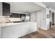 Modern kitchen with an island and marble hexagon tile backsplash at 4739 N Scottsdale Rd # 2002, Scottsdale, AZ 85251