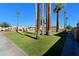 Landscaped community grounds with grassy areas and palm trees at 4754 N 14Th St, Phoenix, AZ 85014