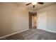 Bedroom with ceiling fan, carpet, and door to hallway at 5350 E Deer Valley Dr # 2268, Phoenix, AZ 85054