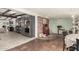 Kitchen features dark grey cabinets, tile floors and a brick-accent wall at 5733 N 10Th Pl, Phoenix, AZ 85014