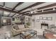 Open concept living room with kitchen view and exposed wood beams at 5733 N 10Th Pl, Phoenix, AZ 85014