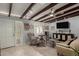 Living room with entryway, exposed beams, and comfortable seating at 5733 N 10Th Pl, Phoenix, AZ 85014