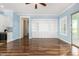 Light and airy living room with hardwood floors and built-in shelving at 660 E Riviera Dr, Chandler, AZ 85249