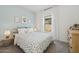 Serene bedroom featuring a wooden bed frame and sea turtle bedding at 7248 S 76Th Ave, Laveen, AZ 85339