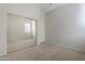 Bedroom with mirrored closet doors and carpeted floor at 9443 W Melinda Ln, Peoria, AZ 85382