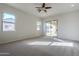 Bedroom with sliding door to the pool area at 9443 W Melinda Ln, Peoria, AZ 85382