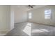 Bright bedroom with carpet flooring and ceiling fan at 9443 W Melinda Ln, Peoria, AZ 85382