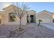 Single-story home with a two-car garage and desert landscaping at 9443 W Melinda Ln, Peoria, AZ 85382