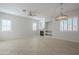 Spacious living room with a fireplace and built-in shelving at 9443 W Melinda Ln, Peoria, AZ 85382