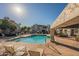 Inviting community pool with lounge chairs and shaded seating at 10115 E Mountain View Rd # 1119, Scottsdale, AZ 85258