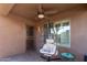 Patio with hanging chair and access to backyard at 11009 W Wikieup Ln, Sun City, AZ 85373