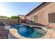 Relaxing kidney shaped pool and spacious patio at 11009 W Wikieup Ln, Sun City, AZ 85373