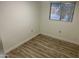 Small bedroom with wood-look floors and closet at 11411 N 91St Ave # 156, Peoria, AZ 85345