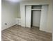 Bedroom with wood-look floors and built-in drawers at 11411 N 91St Ave # 156, Peoria, AZ 85345