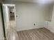 Bright bedroom with light wood floors and white walls at 11411 N 91St Ave # 156, Peoria, AZ 85345