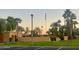 Community view with grassy area and palm trees at 11411 N 91St Ave # 156, Peoria, AZ 85345