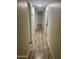 Long hallway with wood-look floors and access to rooms at 11411 N 91St Ave # 156, Peoria, AZ 85345
