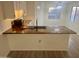 Modern kitchen with butcher block island and new appliances at 11411 N 91St Ave # 156, Peoria, AZ 85345