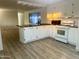 Updated kitchen with butcher block countertops and white cabinets at 11411 N 91St Ave # 156, Peoria, AZ 85345