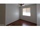 Simple bedroom with wood flooring and a window at 12406 N 82Nd Ln, Peoria, AZ 85381