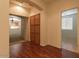 Hallway with wood flooring and access to multiple rooms at 12406 N 82Nd Ln, Peoria, AZ 85381