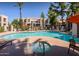 Community pool and spa with lounge chairs at 14145 N 92Nd St # 1008, Scottsdale, AZ 85260