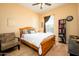 Bedroom with wood floors and built-in shelving at 14575 W Mountain View Blvd # 11309, Surprise, AZ 85374