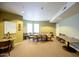 Community room with large table and chairs at 14575 W Mountain View Blvd # 11309, Surprise, AZ 85374