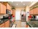 Well-equipped kitchen with stainless steel appliances and granite counters at 14575 W Mountain View Blvd # 11309, Surprise, AZ 85374