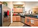 Kitchen with stainless steel appliances and wood cabinets at 14575 W Mountain View Blvd # 11309, Surprise, AZ 85374