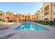Community pool with lounge chairs and BBQ grills at 14575 W Mountain View Blvd # 11309, Surprise, AZ 85374