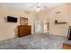 Large bedroom with gray carpet, ceiling fan, and window coverings at 14820 W Verde Ln, Goodyear, AZ 85395