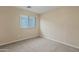 Simple bedroom with carpeted floor and window at 16129 N 21St Ln, Phoenix, AZ 85023