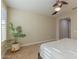 Spacious bedroom with neutral walls, ceiling fan, and ample natural light at 16697 W Alvarado Dr, Goodyear, AZ 85395