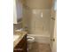 Clean bathroom featuring a shower/tub combo and granite countertop at 1743 E Amber Ln, Gilbert, AZ 85296