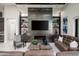 Living room with a modern fireplace and built-in shelving at 17504 E Brushy Mountain Ct, Rio Verde, AZ 85263