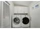 Laundry room with washer, dryer, and cabinets at 18930 W Kaibab Rd, Buckeye, AZ 85326