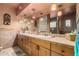 Bathroom with double vanity, glass block shower, and large mirror at 19132 E Via Esquina --, Rio Verde, AZ 85263