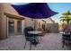 Outdoor patio with table, chairs, and umbrella at 19132 E Via Esquina --, Rio Verde, AZ 85263