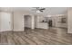 Open-concept living room with wood-look floors and a ceiling fan at 20874 E Sonoqui Dr, Queen Creek, AZ 85142