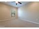 Bright bedroom with carpeted floor, ceiling fan, and window coverings at 21320 N 56Th St # 2175, Phoenix, AZ 85054