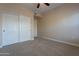 Spacious bedroom with double doors and wall-to-wall carpet at 21320 N 56Th St # 2175, Phoenix, AZ 85054
