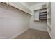Walk-in closet with shelving and built-in storage at 21320 N 56Th St # 2175, Phoenix, AZ 85054