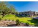 Landscaped community with lush green grass and mature trees at 21320 N 56Th St # 2175, Phoenix, AZ 85054